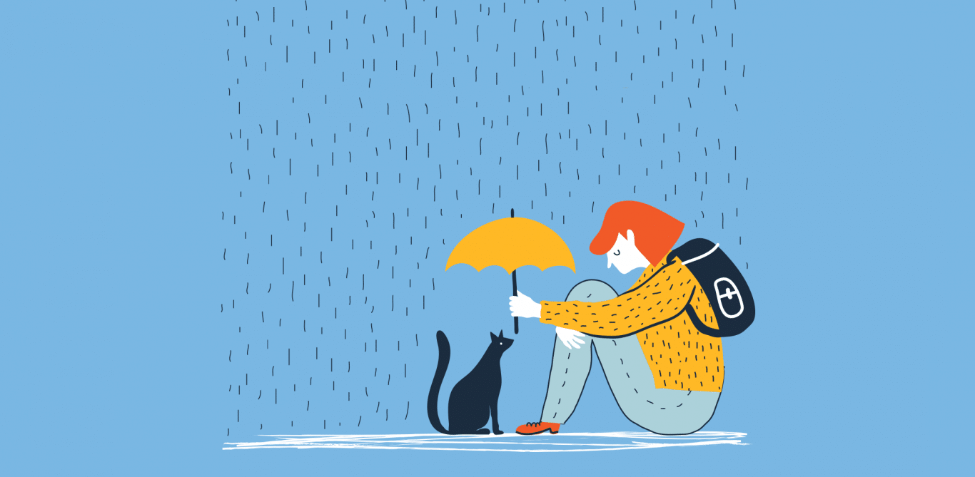 Winterdepression: Eine Frau sitzt mit Katze und Schirm am Boden.